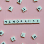 Menopause,Word,Made,Of,Square,Letter,Word,On,Pink,Background.