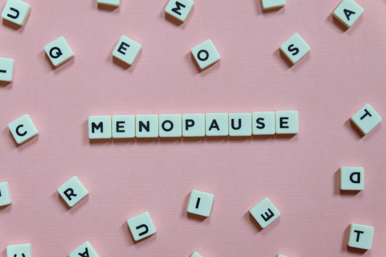 Menopause,Word,Made,Of,Square,Letter,Word,On,Pink,Background.