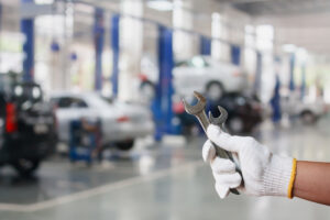 Hand of professional Auto mechanic with wrench