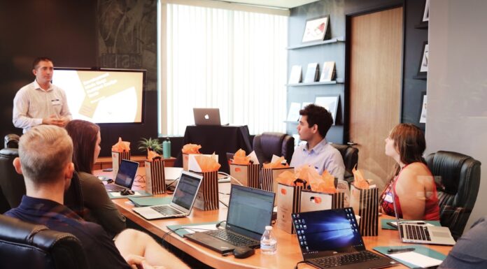 A team in an office discussing computer telephony integration during a meeting