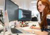 A woman in an office researching computer telephony integration on her computer