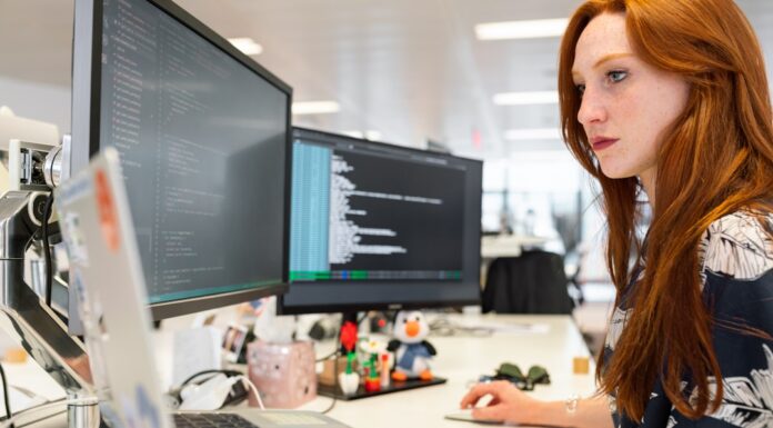 A woman in an office researching computer telephony integration on her computer